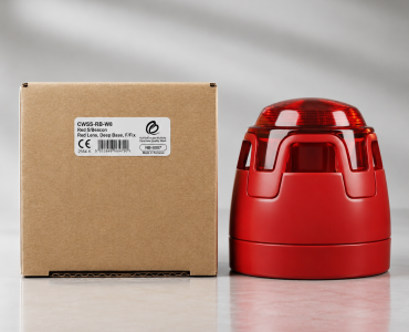 Cardboard shipping box next to a red beacon light on a clean surface.